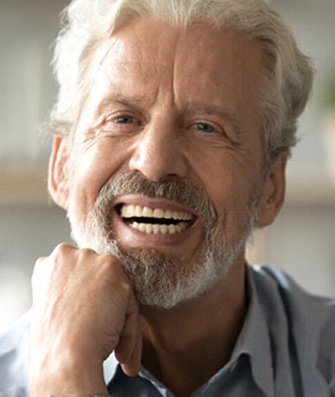 man smiling with dentures