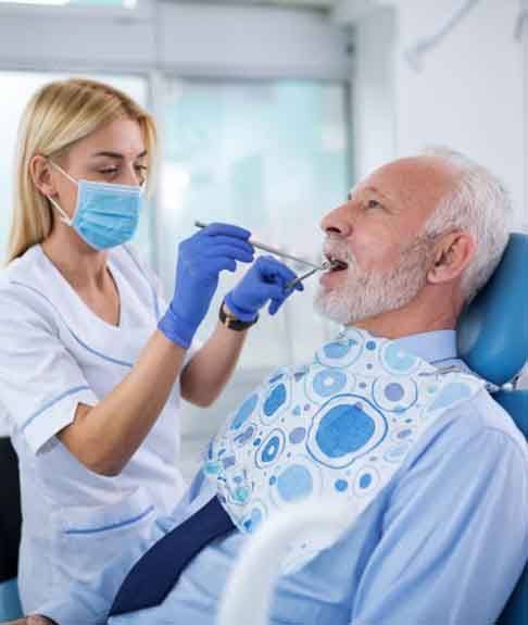 a patient visiting his dentist for a checkup