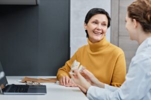 a patient speaking with her dentist