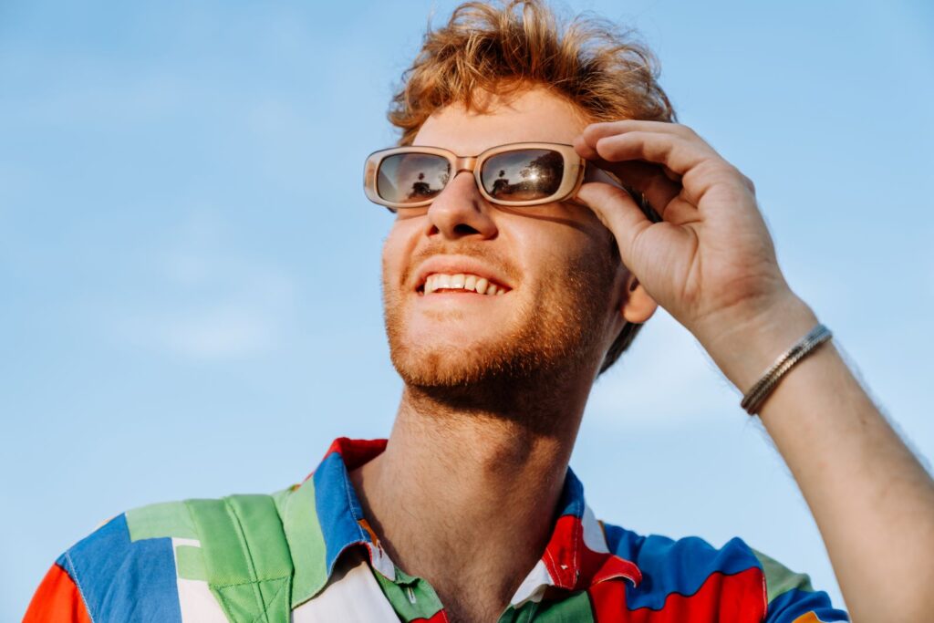 A man in sunglasses smiling